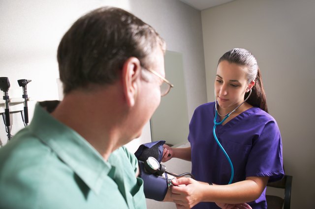 Nurse taking patients blood pressure
