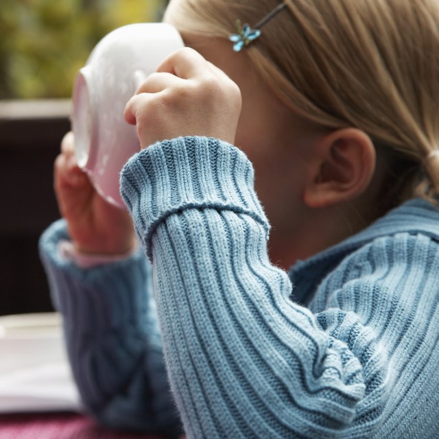 Girl Drinking from Soup Bowl