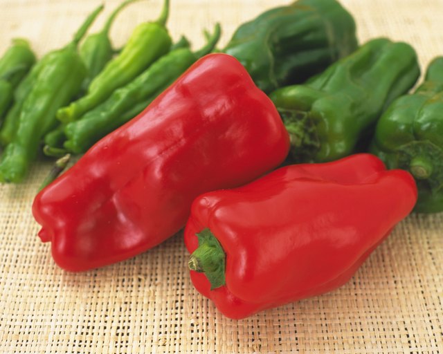 Closed Up Image of Two Red Bell Peppers, Surrounded By Different Peppers, High Angle View, Differential Focus