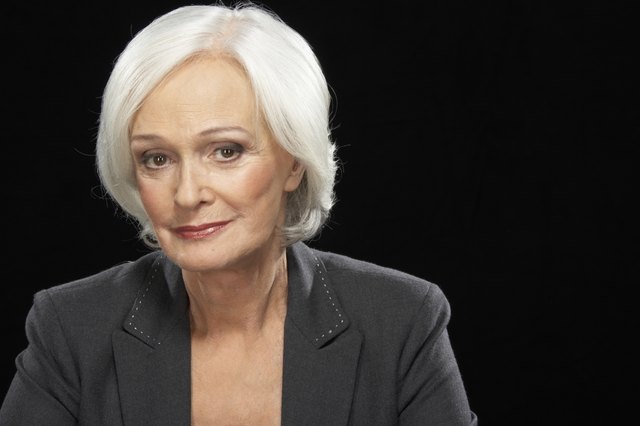 Senior businesswoman smiling, portrait, close-up