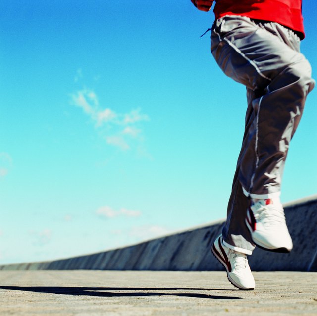close-up of the legs of a man jogging