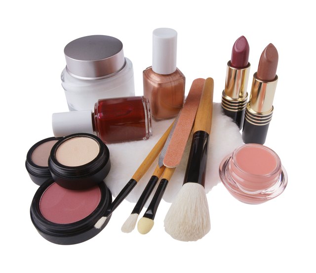 Assorted cosmetics and brushes