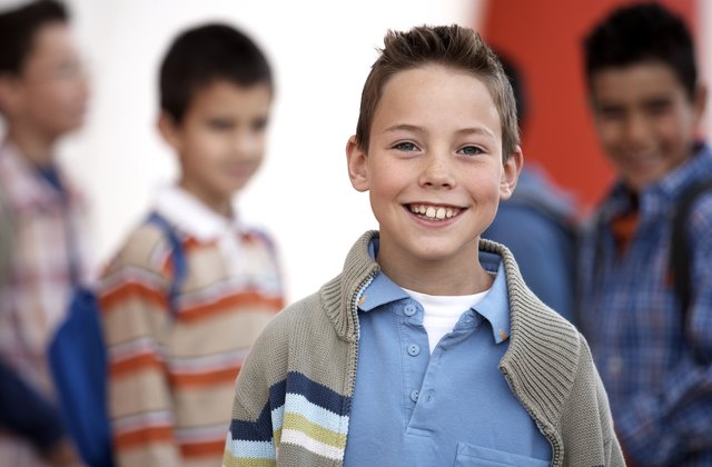 Boy (8-10) smiling, portrait, close-up