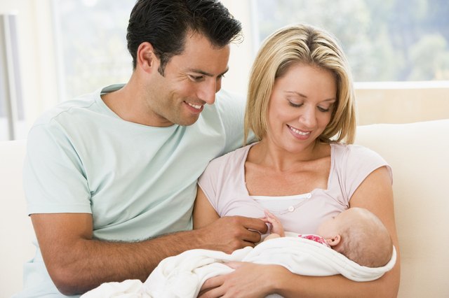 Couple in living room with baby