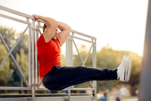 Fitness male model exercising outside