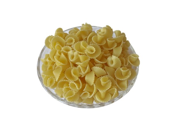 Italian raw pasta in a glass bowl