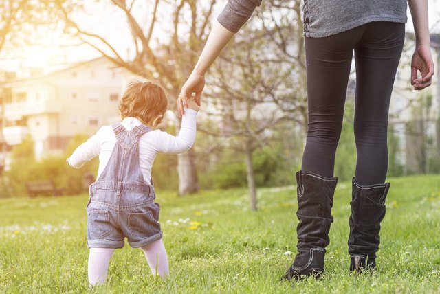 mother and daughter holding hands