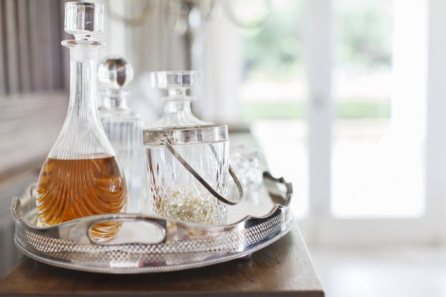 Crystal alcohol decanters on silver tray