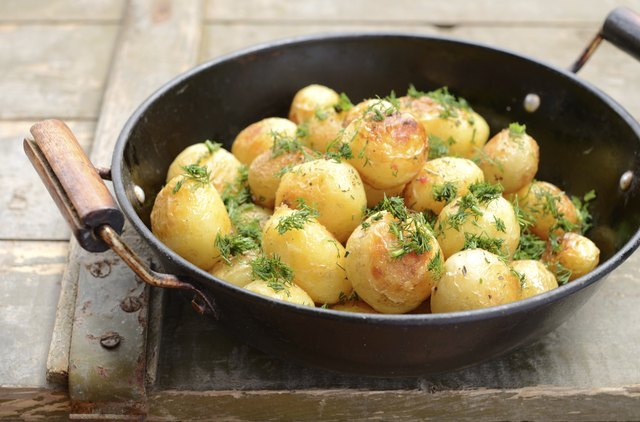 Whole fried potato in old wok
