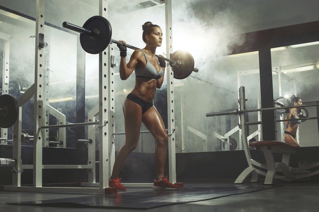 fitness woman lifting weight in gym