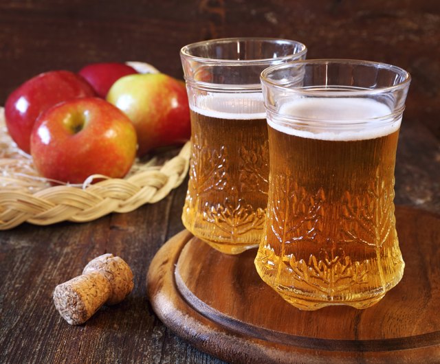Apple cider and red apples