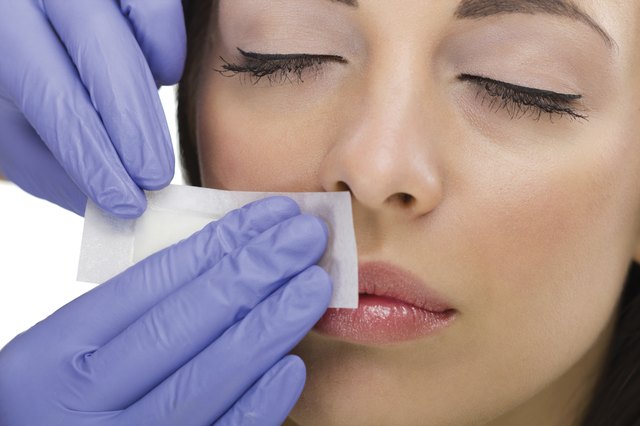 woman reciving facial epilation