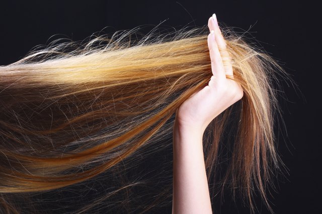 Hand holding hair. Hairstyle