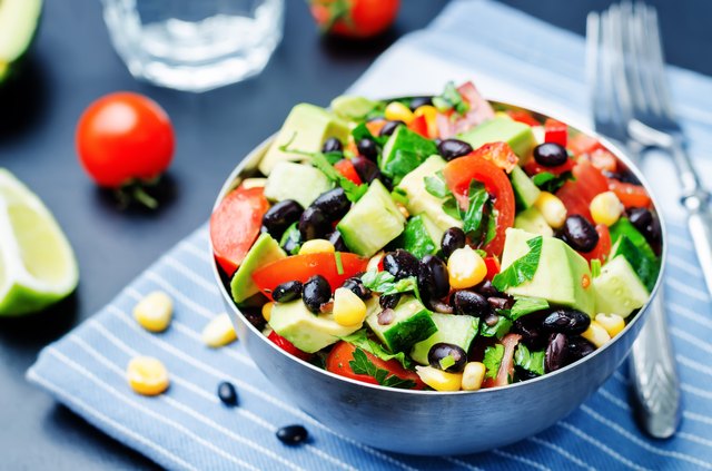 Black beans corn avocado cucumber tomato salad with lime dressing