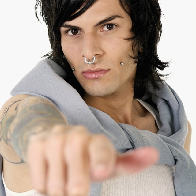 Portrait of a young man with facial piercing