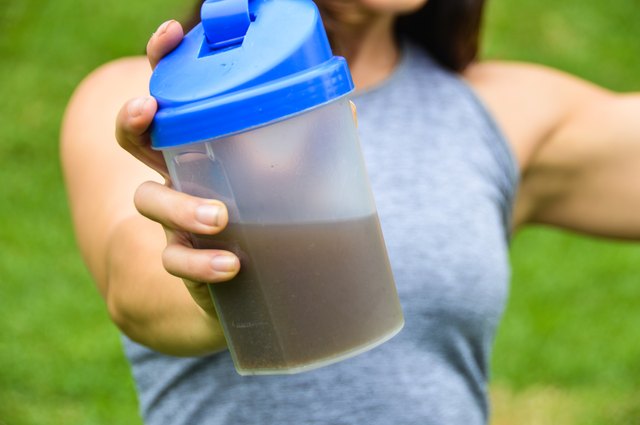 Woman drinking a meal replacement shake (protein shake)