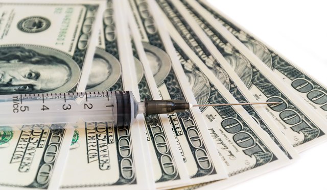 syringe on the money