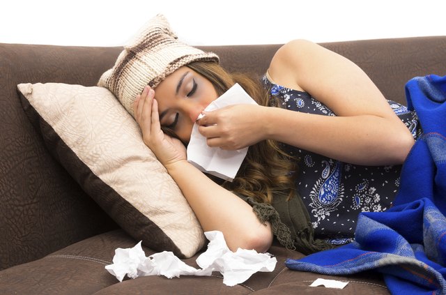 Beautiful young sick girl with a cold