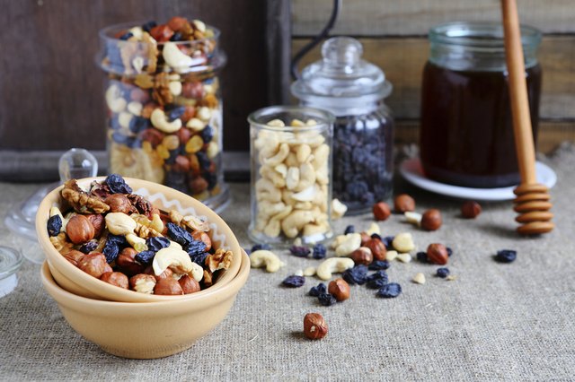 mix nuts in a bowl on the table and jar