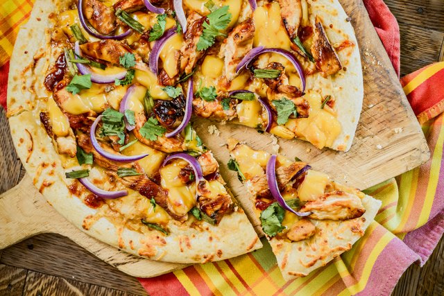 Overhead view of a thin crust barbecue chicken pizza