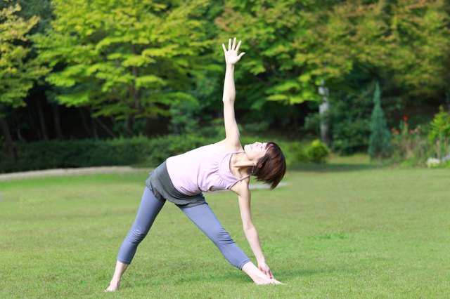 Japanese Woman Doing YOGA "extended triangle pose"