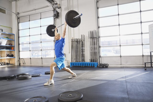 Man practicing Olympic lifts at Crossfit gym