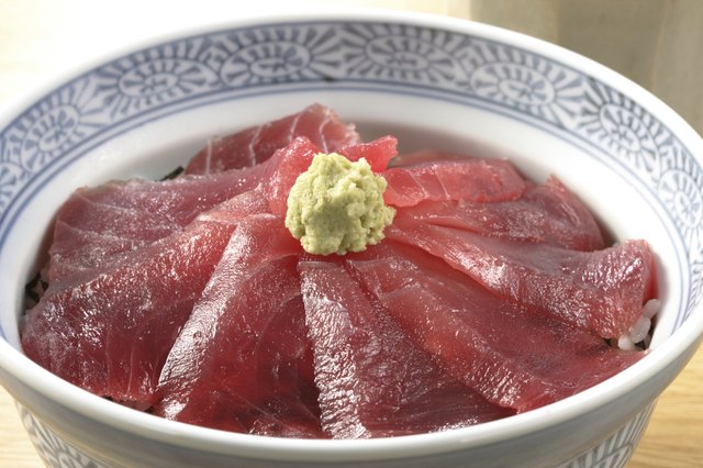 Rice bowl with slices of raw tuna