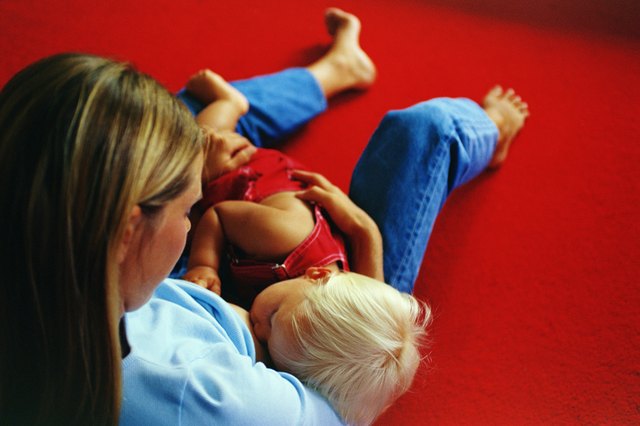 Mother breast feeding son