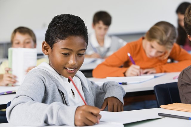 Student taking notes in class