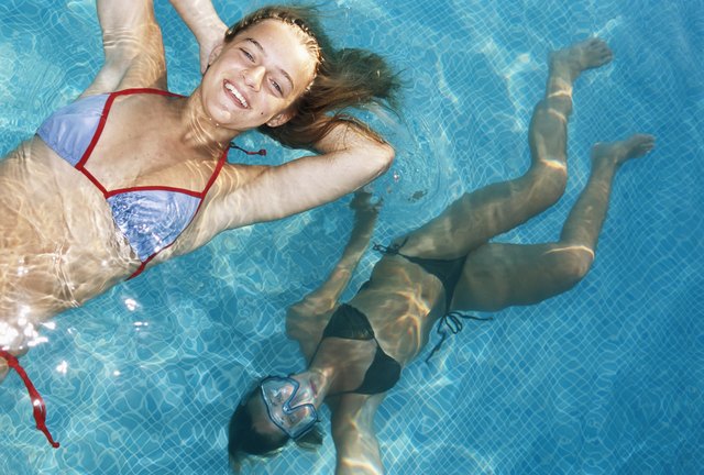 Teenage girls (14-17) floating on water, elevated view