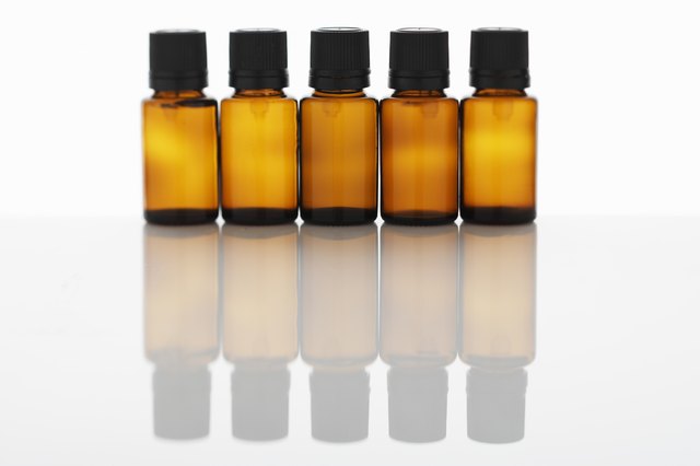 Five bottles of aromatherapy oil side by side