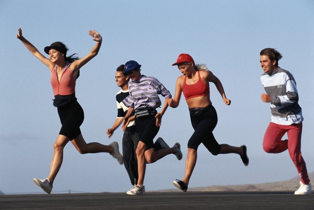 Group of friends running on road
