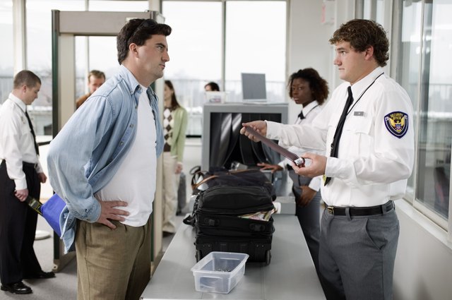 Security guard and man at airport