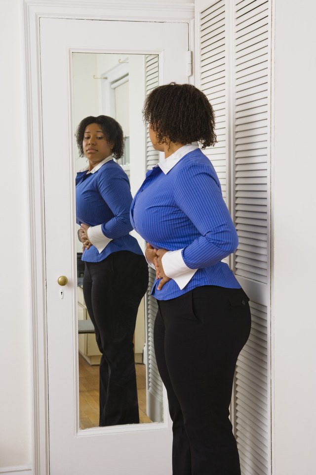 Woman looking in mirror