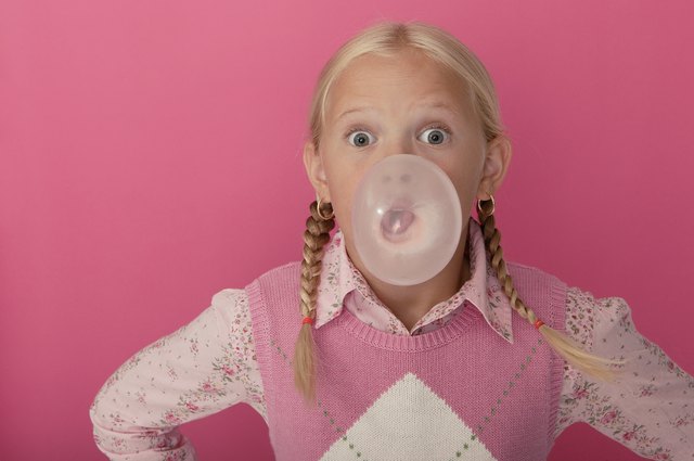 Girl blowing bubble with gum