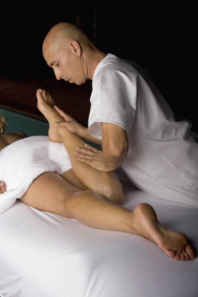 High angle view of a young woman getting a massage from a massage therapist