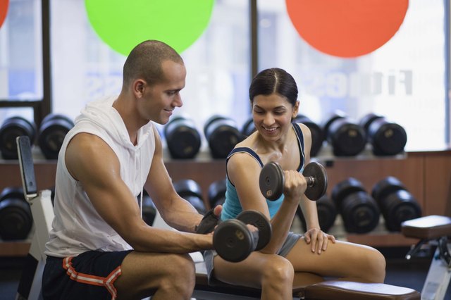 Couple lifting weights
