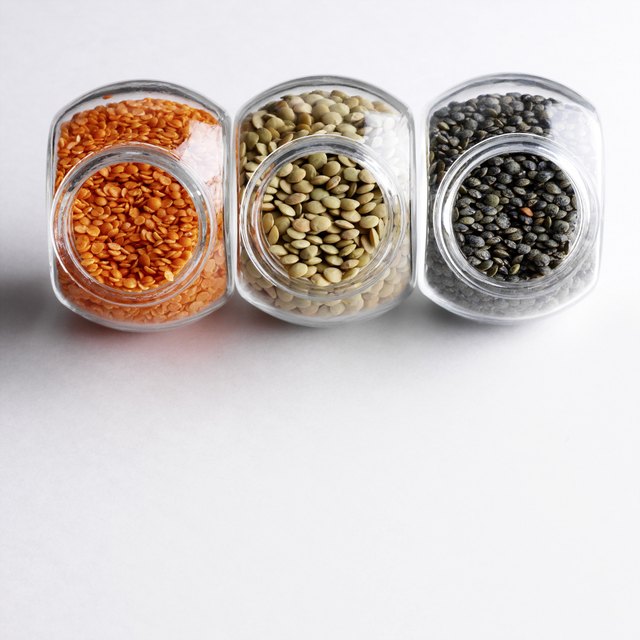 Colorful lentils in glass jars