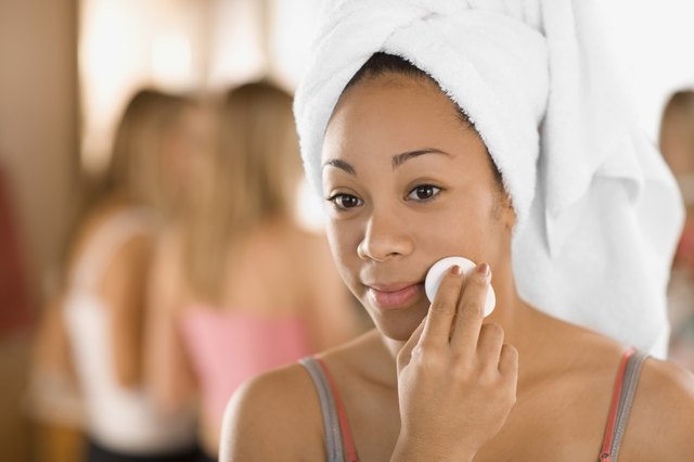Teenage girl removing makeup
