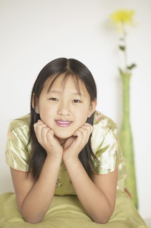 Girl resting her chin on her hands