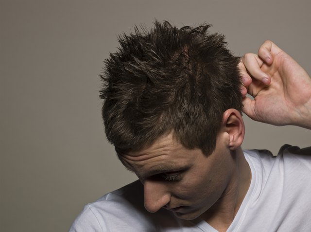 Man scratching head