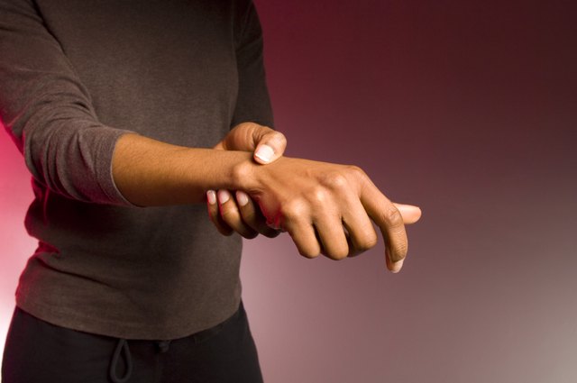 Woman holding wrist