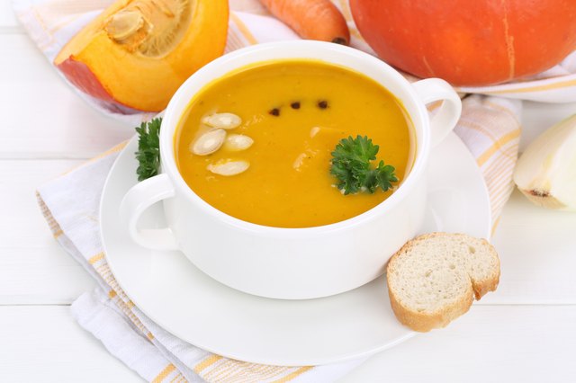 Pumpkin soup with pumpkins in cup