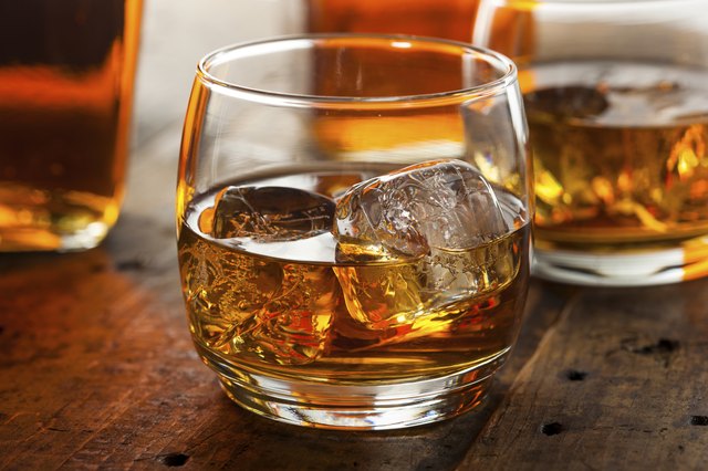 Alcoholic Whiskey Bourbon in a Glass with Ice