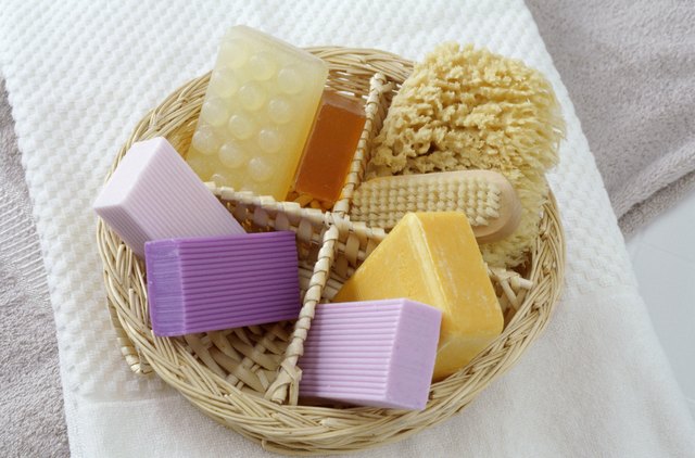 Basket of soaps with a brush and sponge