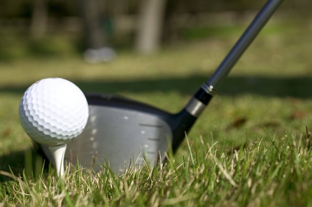 Golf club and golf ball on tee