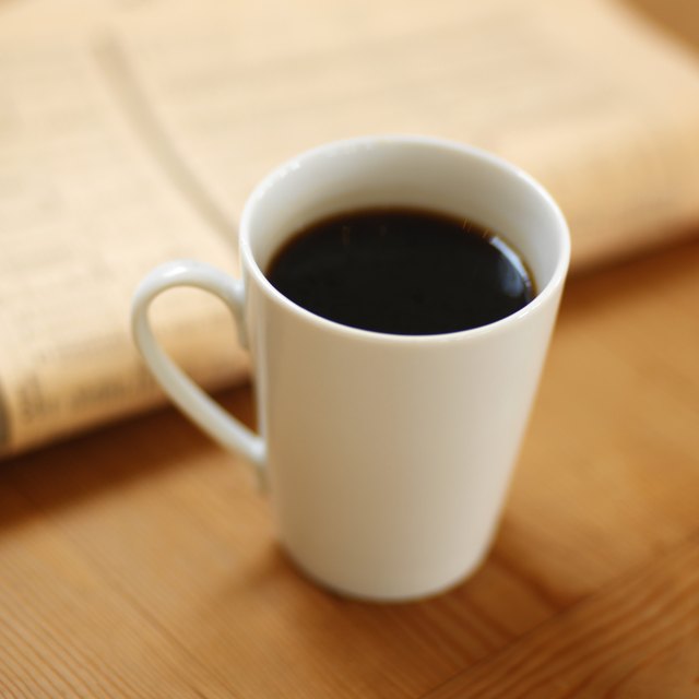 elevated view of a mug of black coffee