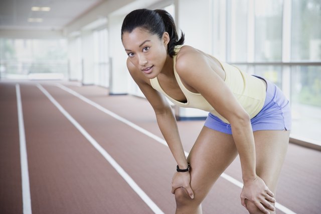 Female runner on indoor track