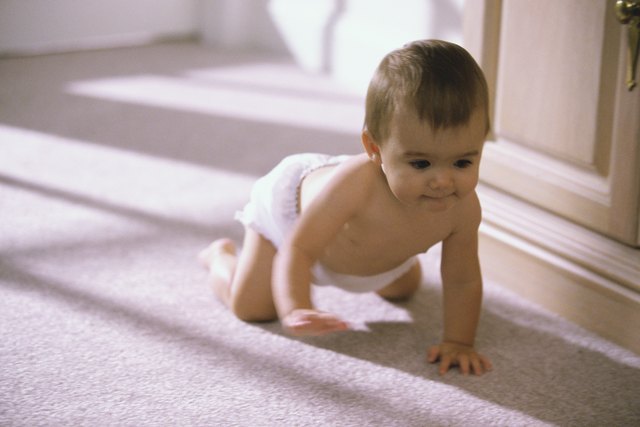 Baby boy crawling on the floor