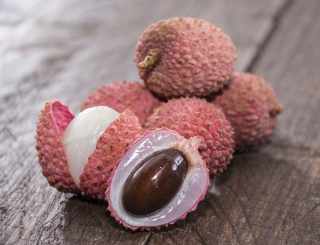 Fresh Lychees on wooden background